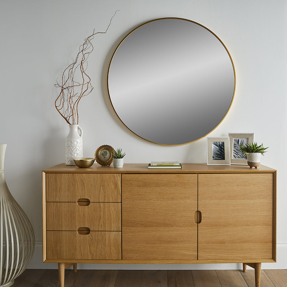 Le miroir mural rond doré meuble d'entrée